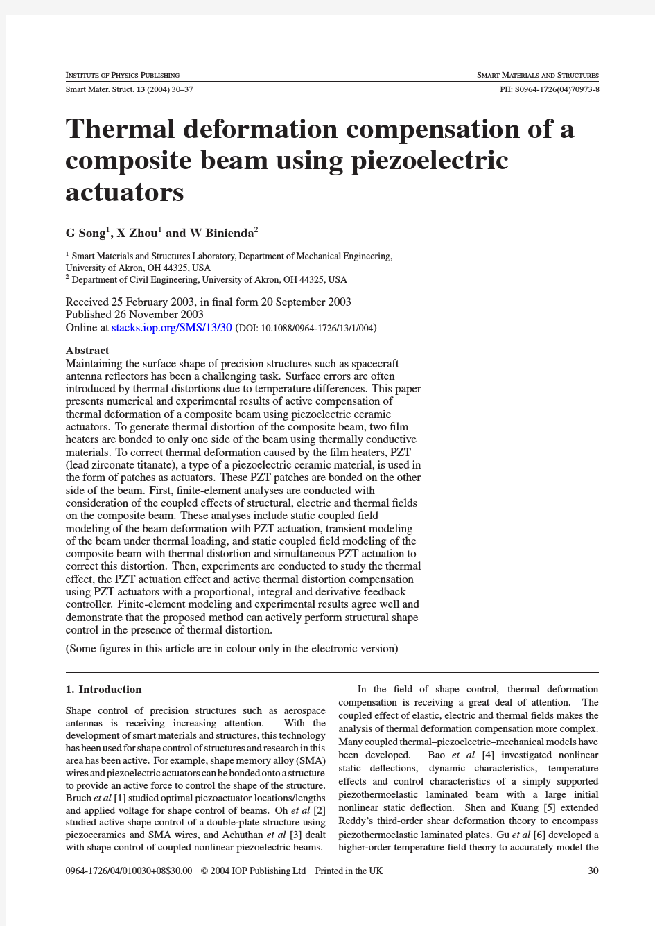 Thermal deformation compensation of a composite beam using piezoelectric actuators